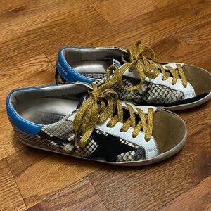 Golden Goose Snake Print Sneakers with Gold and Black Accents